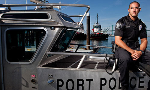 Los Angeles Port Police Officer against a boat