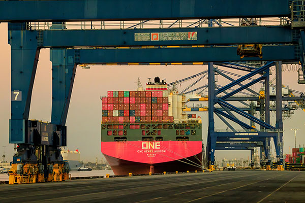 A pink ONE container ship docked at Port of Los Angeles' Yusen Terminal.